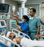 Indian neuro-trauma surgical team and critical care nurses attending to a patient in modern emergency neuro-ICU